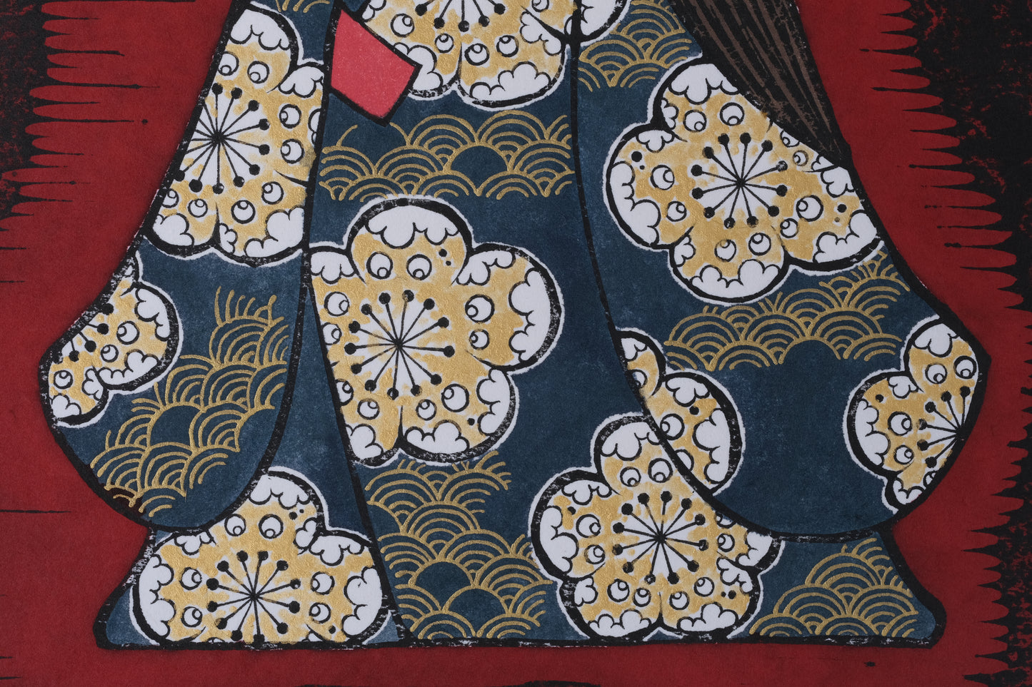 Traditional Japanese kimono with intricate patterns on a red background
