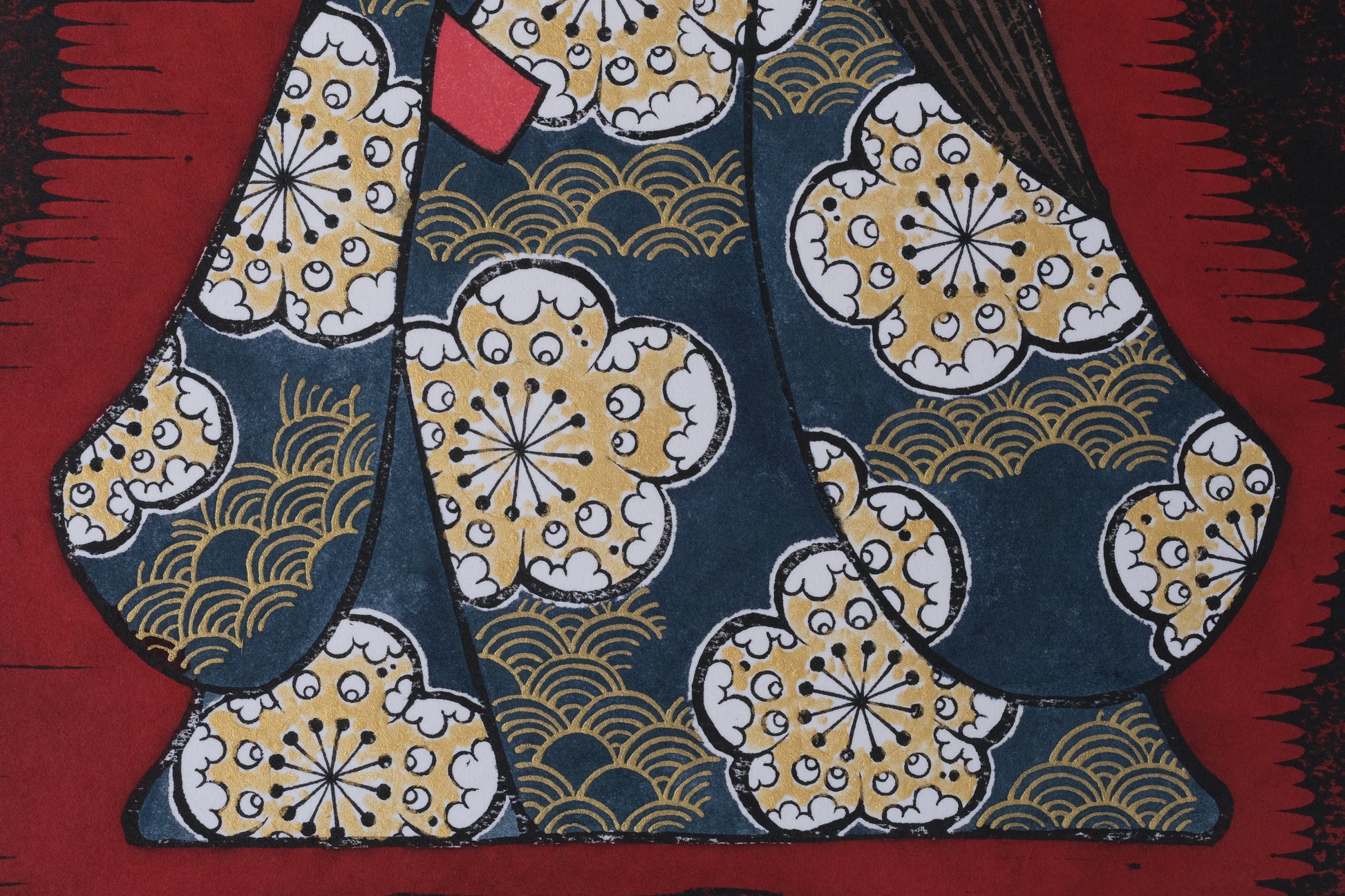 Traditional Japanese kimono with intricate patterns on a red background